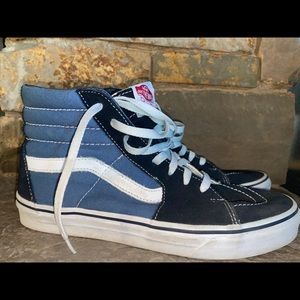 Blue and black high top vans
